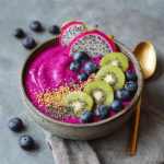 Served dragon fruit smoothie bowl with toppings